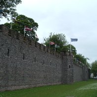 cardiff castle, canadian flag flying next to welsh flag