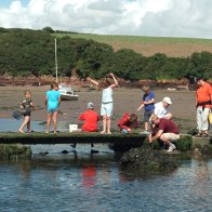 Families fishing for crabs Sandy Bay Pembrokeshire