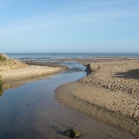 Lligwy beach river headed out to sea