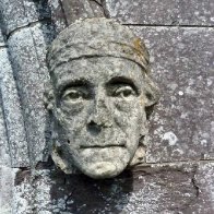 Small sculpted head on doorway at St. David's Cathedral