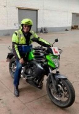 Ron Lewis sitting on a motorcycle in Wales